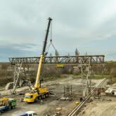 Кран козловой электрический передвижной г/п 32,5/10,0т., пролет 25,0м. с грузовой телегой и проходной галереей для обслуживания крана